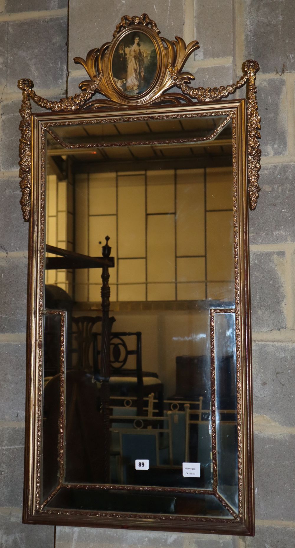 A reproduction gilt framed wall mirror, W.60cm, H.126cm